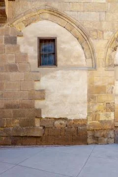Front view of grunge stone bricks wall and small window Stock Photos