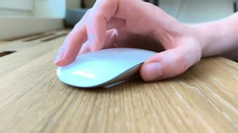 Front view of a hand scrolling with a computer mouse. Fingers rotating the .. Stock Footage 340283726