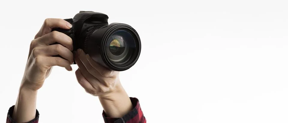 Front view hands holding camera. High quality beautiful photo concept Stock Photos