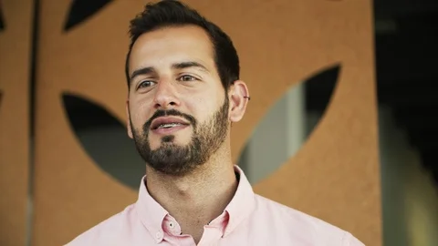 Front view of handsome young man talking Stock Footage 119978557