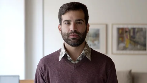 Front view of happy joyful bearded guy posing indoors Stock Footage 121001829