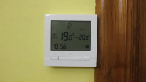 Front view of a heating thermostat Stock Footage 322026843