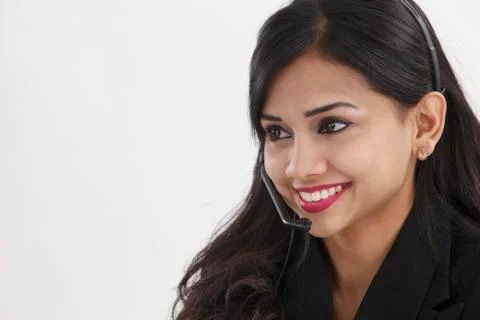 Front view of help desk operator answering phone call Stock Photos