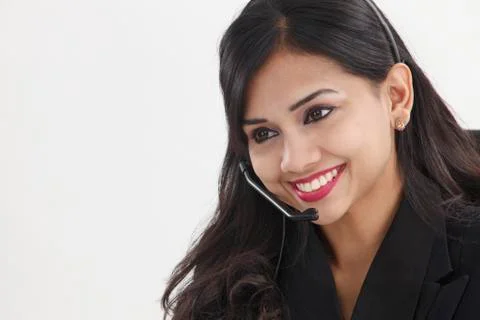 Front view of help desk operator answering phone call Stock Photos