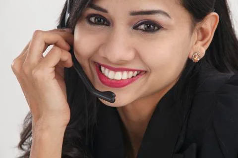 Front view of help desk operator answering phone call Stock Photos