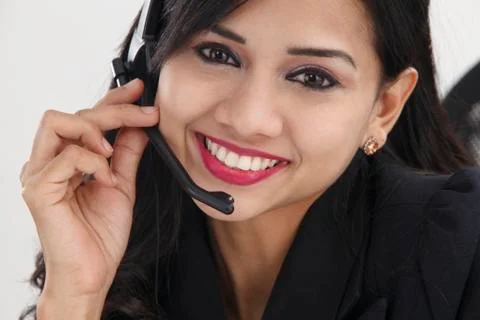Front view of help desk operator answering phone call Stock Photos