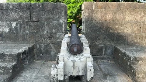Front view of a historic spanish cannon in an Intramuros wall embrasure 4K Stock-Footage 337457941
