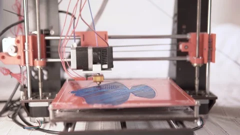 Front view of a home made 3d printer working on a face mask prototype 動画素材 129719495