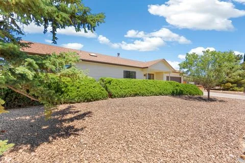 The front view of a home with a yard Stock Photos
