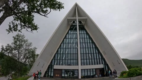 Front view of iconic Arctic Cathedral with visitors walking in Tromso Norway Video stock 341272675