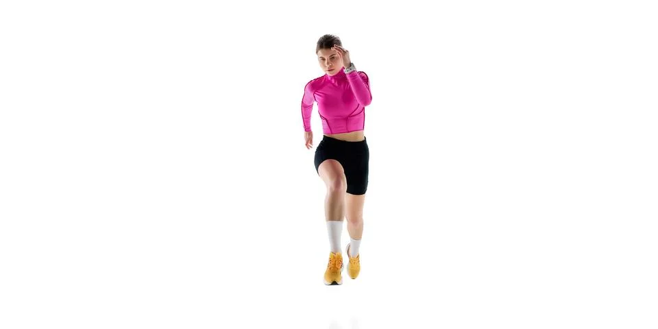 Front view image of concentrated young woman in sportswear, runner in motion Stock Photos