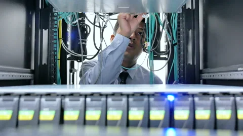 Front view of IT engineer checking and maintenance cable of data center. Stock Footage 156250008