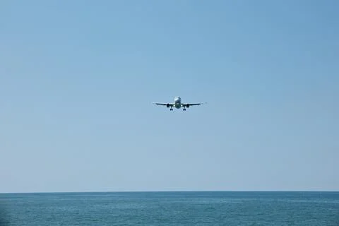 Front View of Jet Passenger Plane Flying Over the Sea Stock Photos