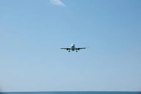 Front View of Jet Passenger Plane Flying Over the Sea Stock Photos