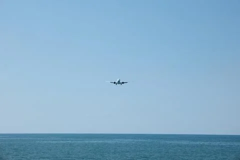 Front View of Jet Passenger Plane Flying Over the Sea Stock Photos