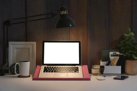 Front view laptop computer with blank screen, picture frame, coffee cup and p Stock Photos