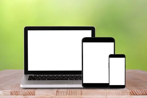 Front view of the laptop, tablet pc, smartphone is on the work table with b.. Stock Photos
