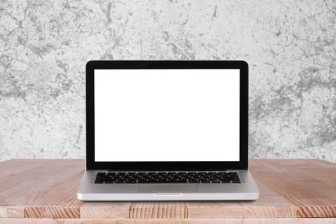 Front view of the laptop is on the work table with white concrete background Stock Photos