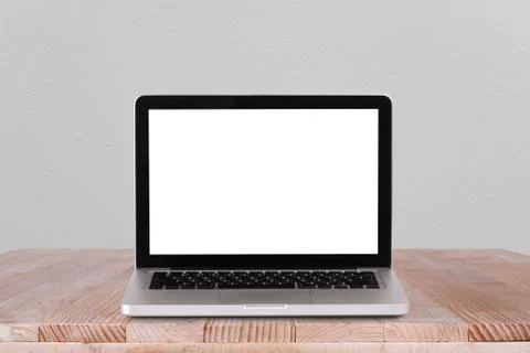 Front view of the laptop is on the work table concrete background Stock Photos