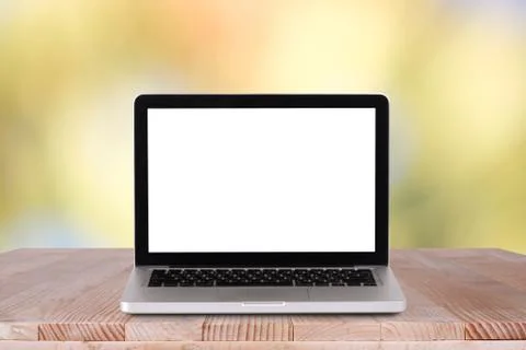 Front view of the laptop is on the work table with bokeh green background Foto stock
