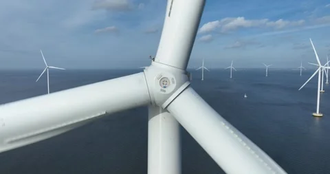 Front view of a large wind turbines on water. off shore wind park, The Stock Footage 303543644