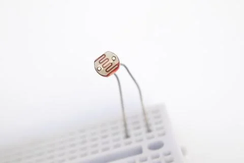 Front view of an LDR (Light Dependent Resistor) embedded in a project board o Stock Photos