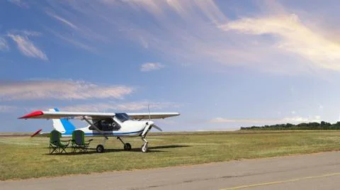 Front view of light aircraft with piston engine on airfield with two folding  Stock Photos