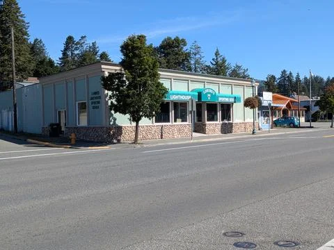 Front view of “Lighthouse Sporting Goods,” a small-town local shop Stock Photos