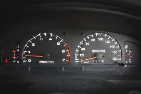 Front view of main dashboard with speedometer and tachometer in a used car Stock Photos