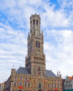 Front view of the main tower of old part in Bruges. Stock Photos