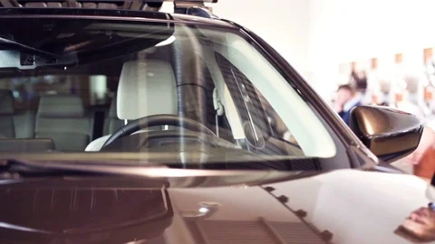 Front view of male customer examining car Stock-Footage 86731461