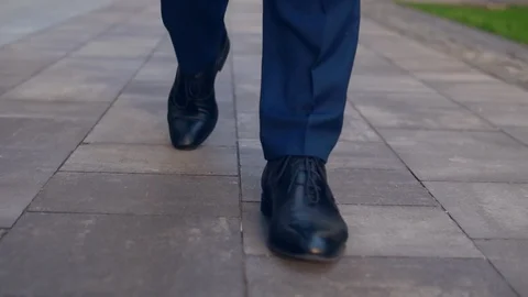 Front view of male legs commuting on the sidewalk Stock Footage 92056282