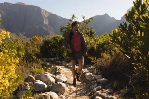 Front view of man with a backpack walking on a trail Fotos Stock
