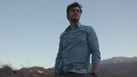 Front View of Man on Hike Thoughtfully Looking Off Stock Footage 95933326