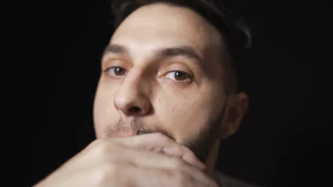 Front view of man shaving beard and trimming his mustache Stock Footage 131086463