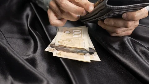 Front view - a man taking out money in his fancy walle 4k. Stock Footage 96024834