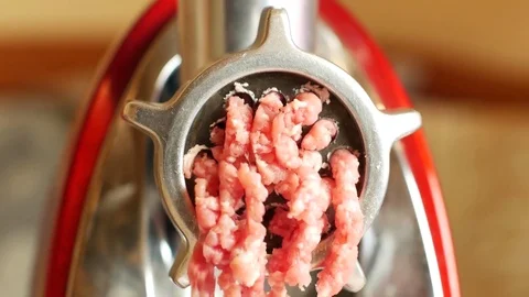 The front view of the meat grinder during the preparation of stuffing. Stock Footage 83686666