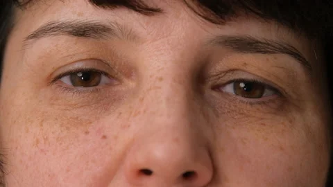 Front view of middle aged eyes of mature woman. Elderly female looking at the Stock Footage 171461205
