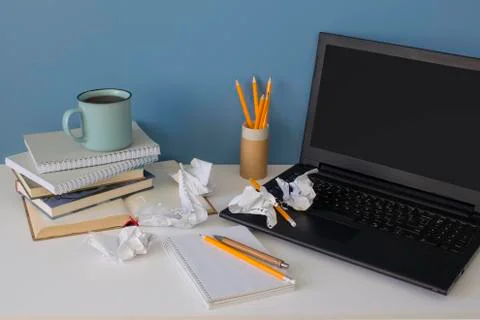 Front view on modern creative workspace of a creative entrepreneur with mess on Stock Photos