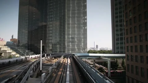 Front view from modern driverless train moving on elevated railway through .. Stock Footage 334832760