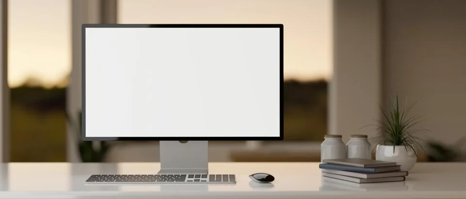 Front view of a modern workspace in a modern office room with a PC desktop .. Ilustración de archivo