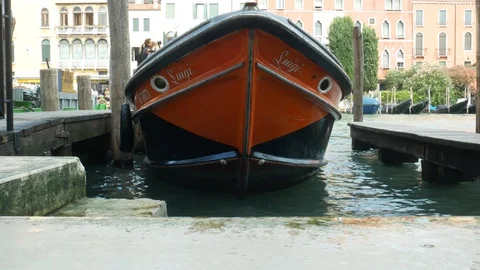 Front view of moored motor boat on Grand Canal in Venice Stock Footage 128929997