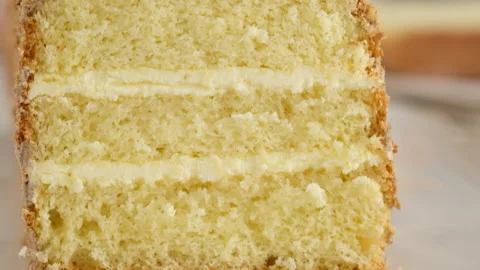 Front view. The movement of the camera over the sponge cake with chocolate cream Stock Footage 146480554