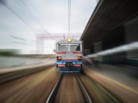 Front view of a moving train with zoom blur. Stock Photos
