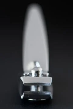 Front view of nail clipper isolated on grey  background. Close up with blurry Stock Photos