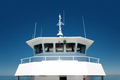 Front view of  the navigation cabine on a passenger ship on blue sky backgrou Stock Photos