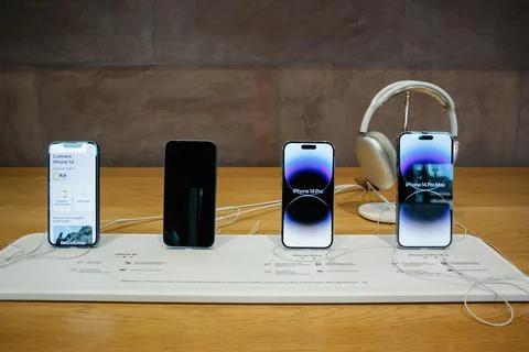 Front view of new Apple Computers iPhone 4 Pro Plus Max in a row Stock Photos