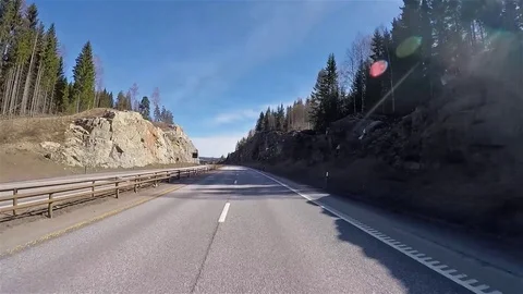 Front view of Norway highway road with stones and forests 動画素材 90359463