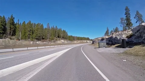 Front view of Norway highway road with stones and forests 動画素材 90359580