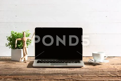 The front view of notebook and cup of coffee. Inspiration and mock-up concept Stock Photos